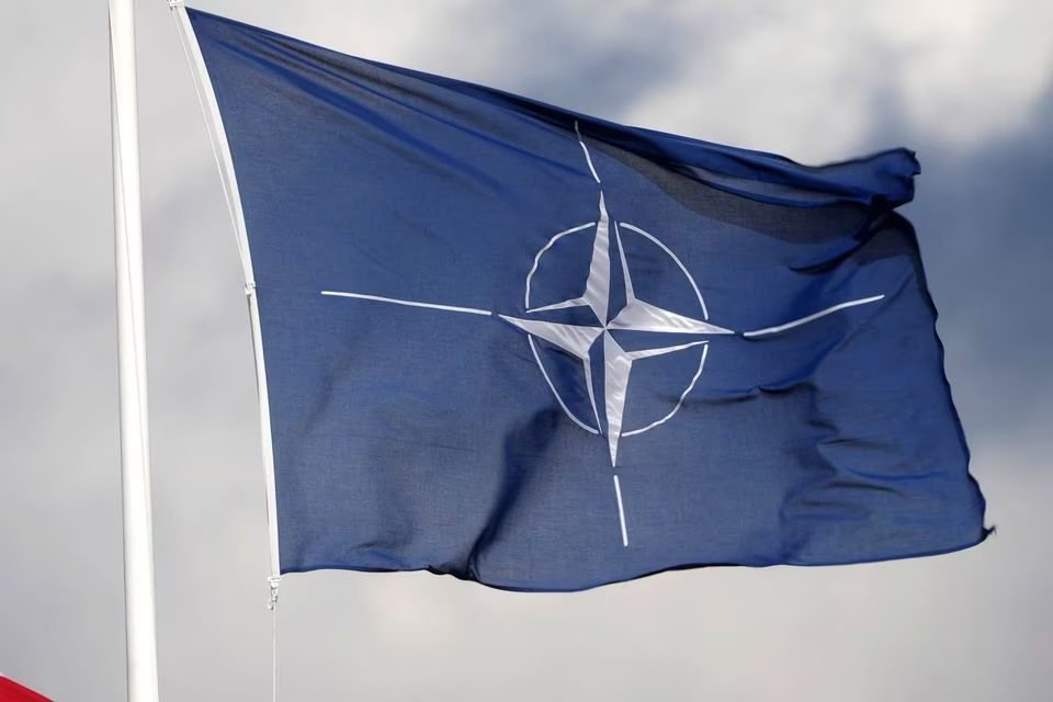 A NATO flag flutters at the Tapa military base, Estonia April 30, 2023. REUTERS/Ints Kalnins