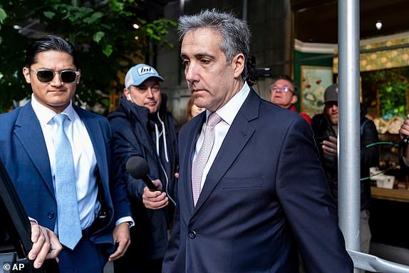 FILE - Michael Cohen leaves his apartment building on his way to Manhattan criminal court, May 13, 2024, in New York. The testimony in Donald Trump's hush money trial is all wrapped up after more than four weeks and nearly two dozen witnesses, meaning the case heads into the pivotal final stretch of closing arguments, jury deliberations and possibly a verdict. Expect the defense to attack the credibility of Cohen, who pleaded guilty to federal charges related to the payment and who was accused by Trump's lawyers of lying even while on the witness stand. (AP Photo/Julia Nikhinson, File)