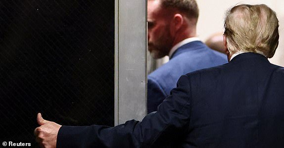 Republican presidential candidate and former U.S. President Donald Trump gives a thumb up during a break, as his criminal trial over charges that he falsified business records to conceal money paid to silence porn star Stormy Daniels in 2016 continues, at Manhattan state court in New York City, U.S. May 28, 2024. REUTERS/Andrew Kelly/Pool