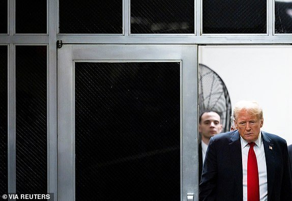 Republican presidential candidate and former U.S. President Donald Trump walks during a break, as closing arguments continue during the criminal trial over charges that he falsified business records to conceal money paid to silence porn star Stormy Daniels in 2016 continues, at Manhattan state court in New York City, U.S. May 28, 2024. JUSTIN LANE/Pool via REUTERS