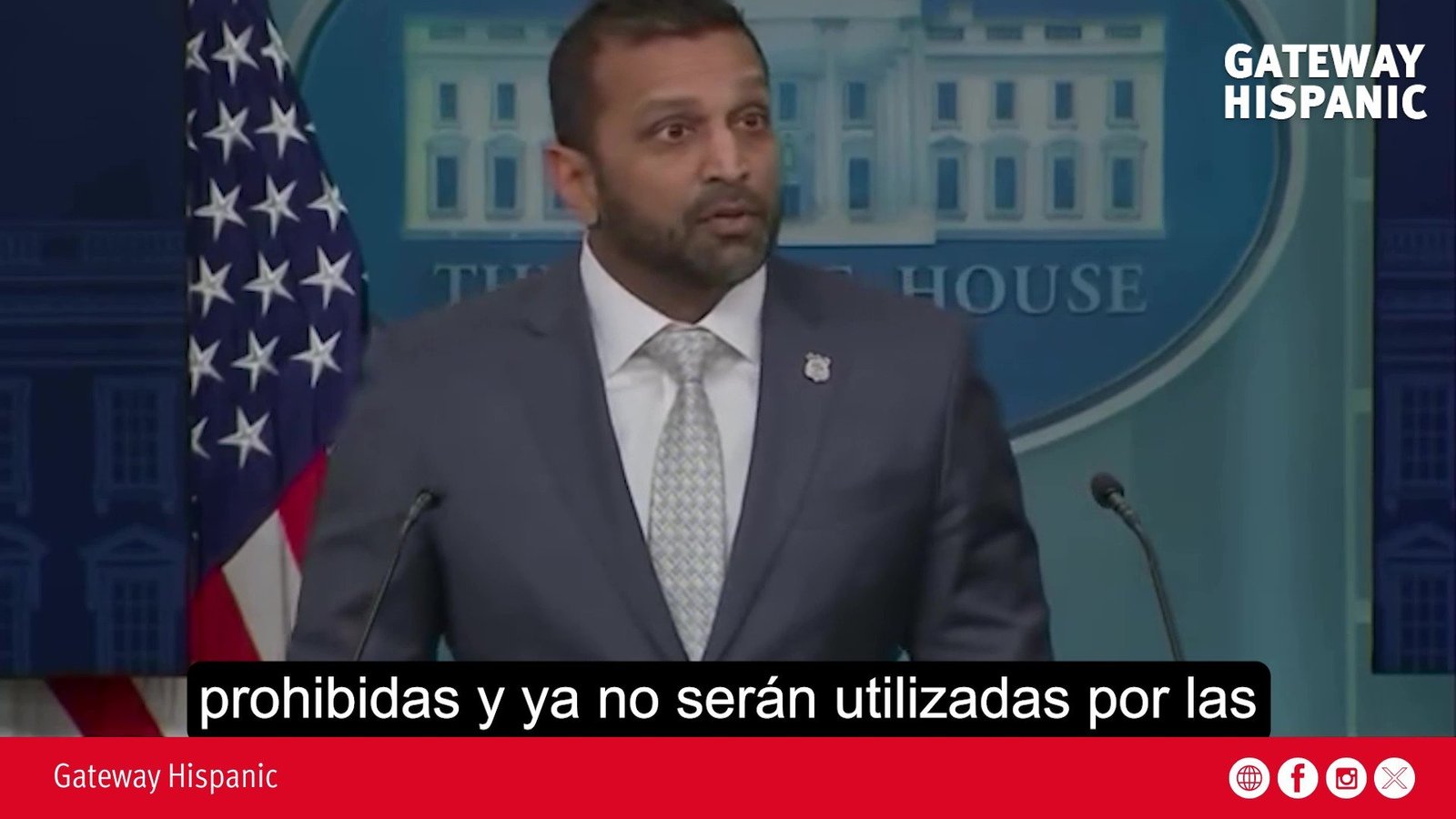 Press briefing at the White House featuring Kash Patel discussing prohibited actions, with the American flag in the background.