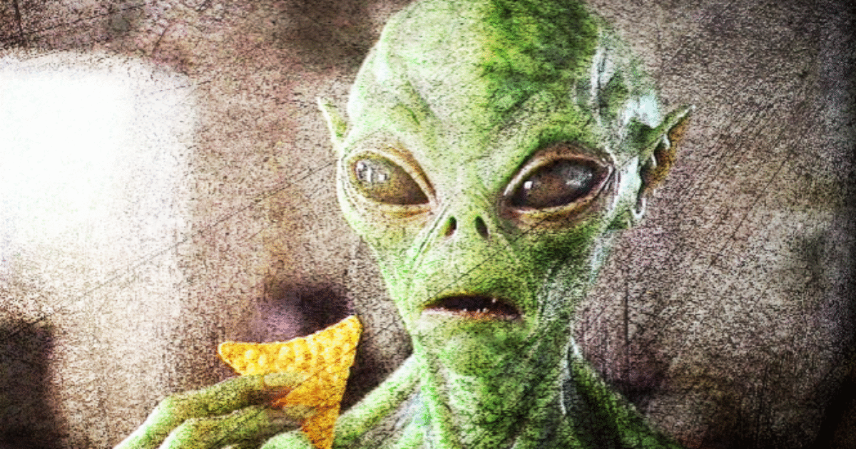 Green alien holding a tortilla chip, exhibiting a surprised expression in a textured background.