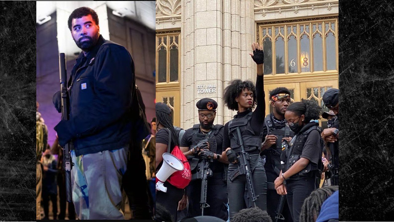 Image of armed protesters gathered at a city hall, demonstrating for social justice and community rights, showcasing solidarity and activism in urban settings.