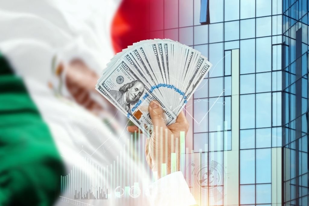 Hand holding a fan of hundred dollar bills in front of a modern building with financial graphs, symbolizing wealth and investment opportunities.
