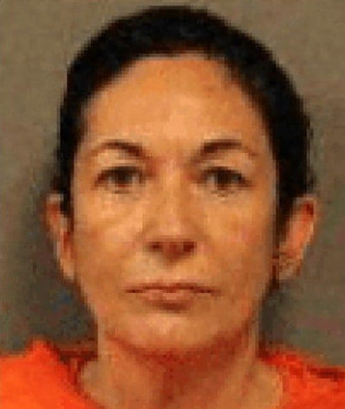 Mugshot of a woman wearing an orange prison jumpsuit, facing the camera with a neutral expression.