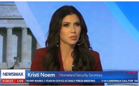Kristi Noem, Homeland Security Secretary, speaking during a live segment on Newsmax, with a backdrop of the Lincoln Memorial.
