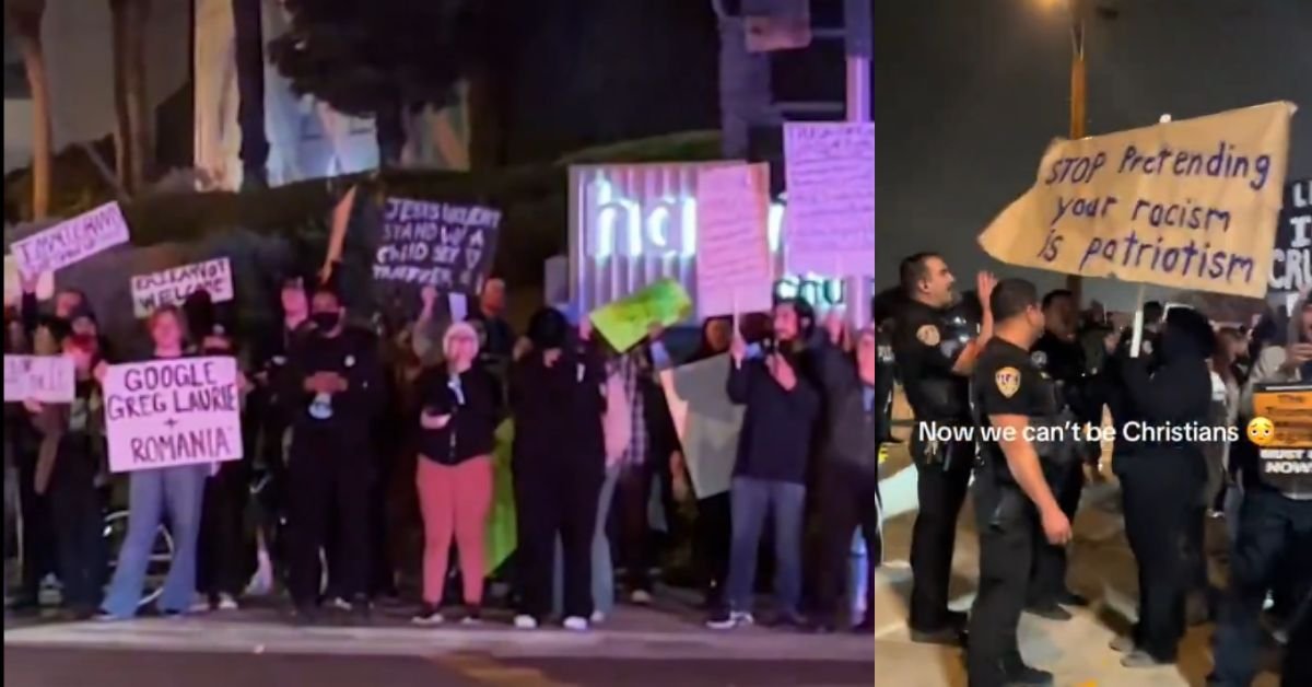Protesters holding signs addressing social issues and police standing by during a nighttime demonstration.