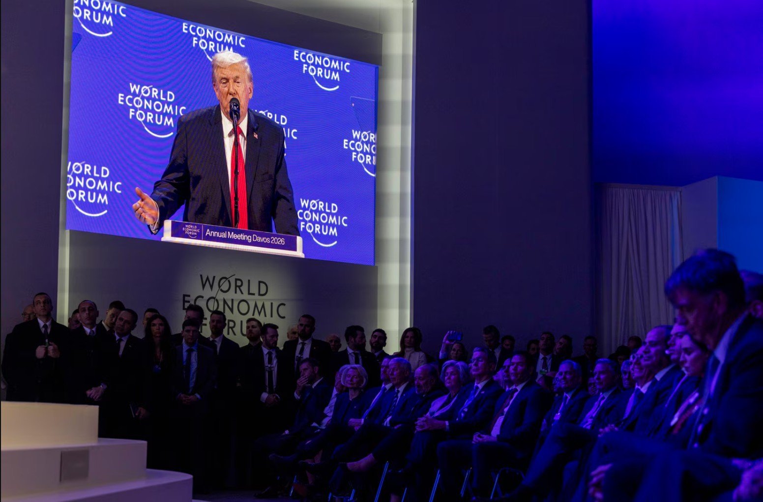 Donald Trump speaks at the World Economic Forum Annual Meeting in Davos 2026, with an audience of global leaders and officials listening attentively.