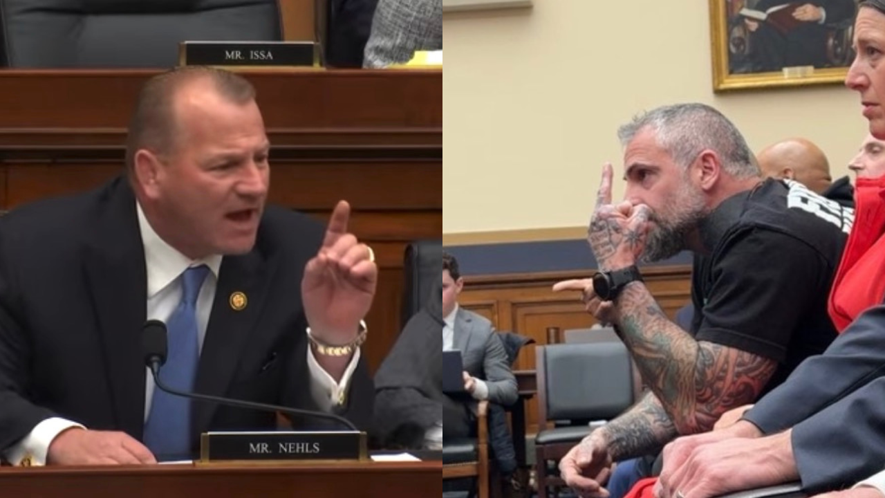 Congressman passionately speaks during a hearing while a visibly frustrated audience member gestures, highlighting tensions in the proceedings.
