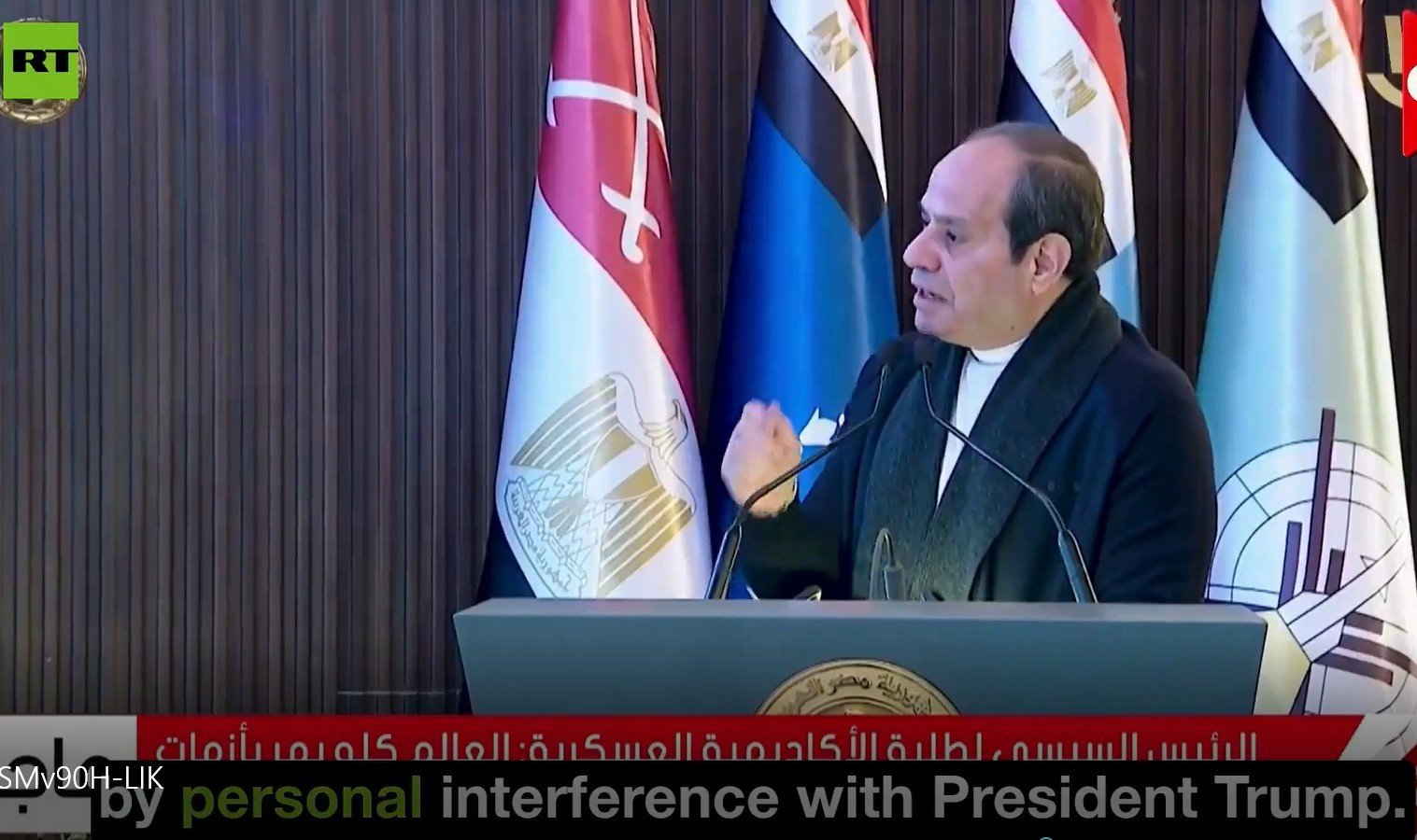 Egyptian President addressing an audience with national flags in the background, discussing international relations and political topics.