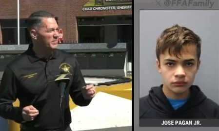 Sheriff Chad Chronister speaks at a press conference alongside a mugshot of Jose Pagan Jr. related to a recent criminal investigation.