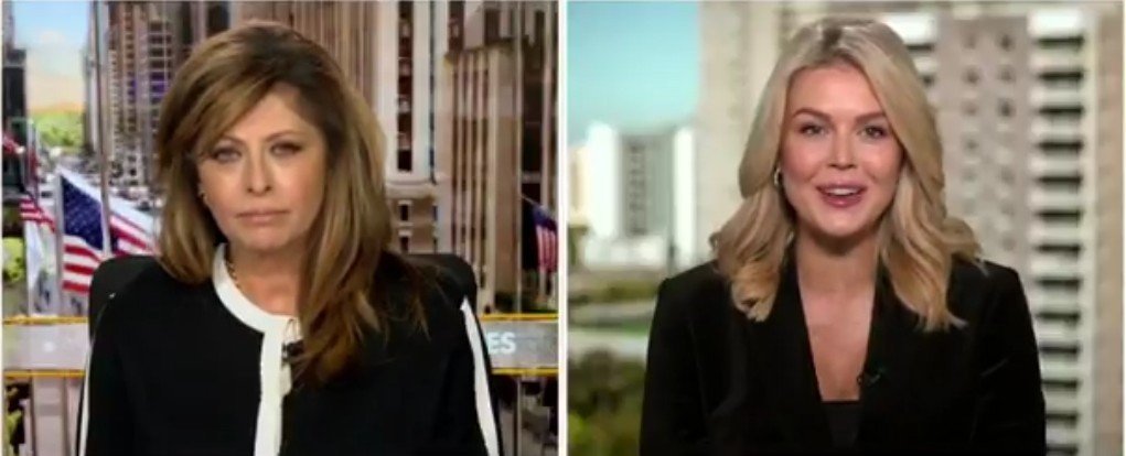 Two female news anchors discussing current events, with a backdrop of city buildings and American flags visible in the background.